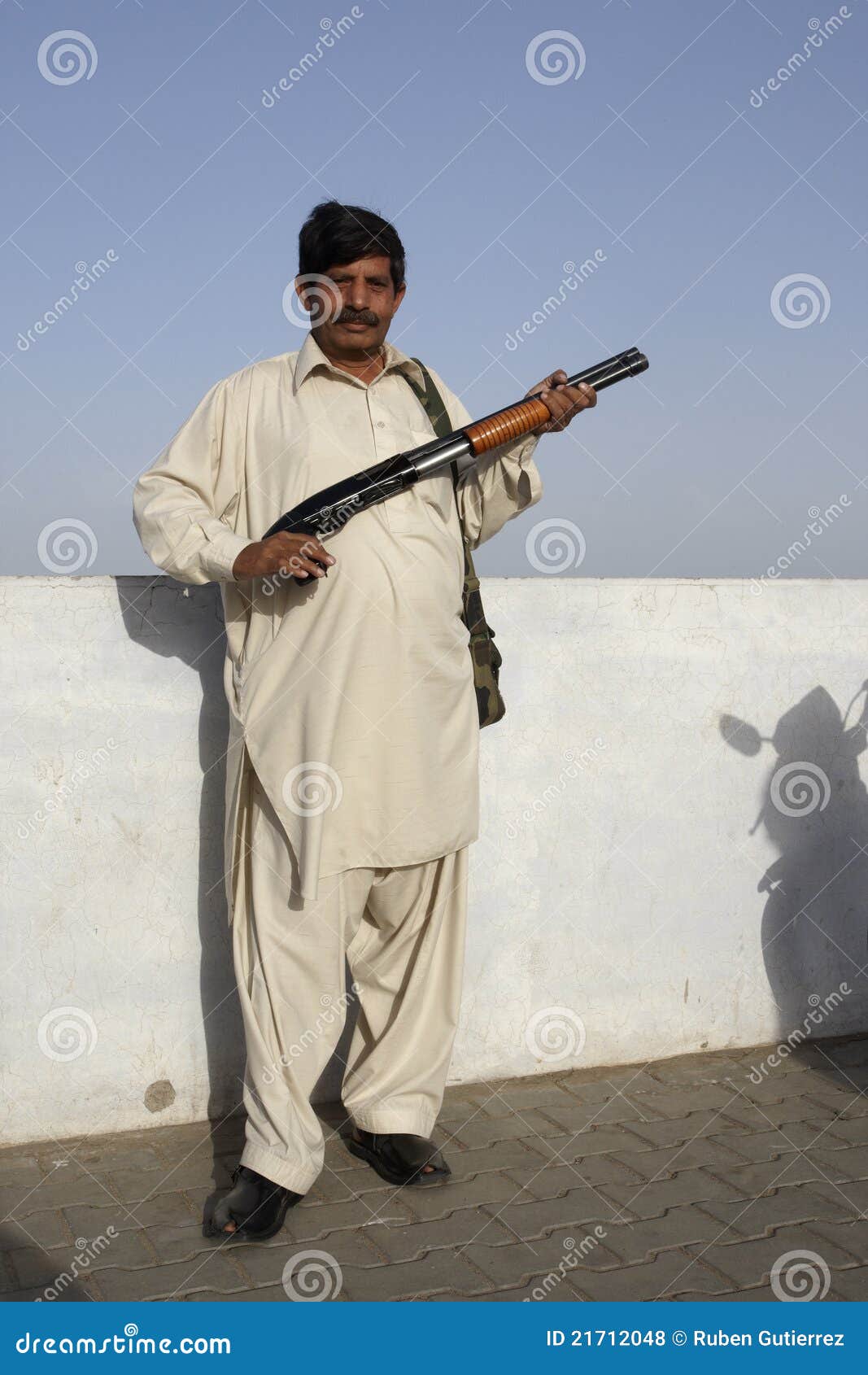Pakistani man with shotgun editorial stock photo. Image of diversity