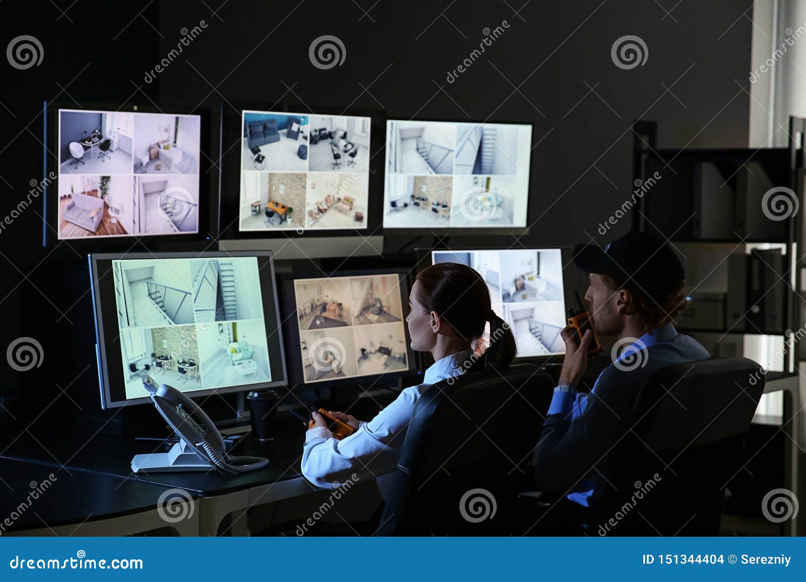 security guards monitoring modern cctv cameras in surveillance room