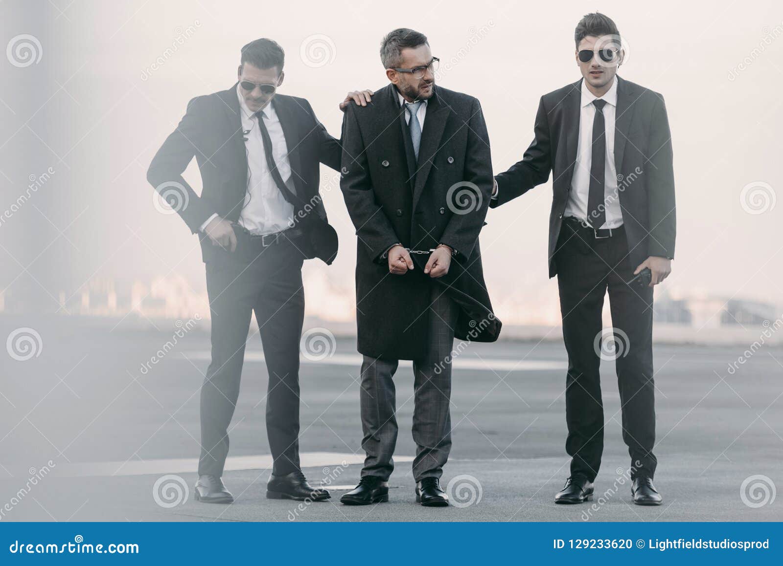 Security Guards Standing with Arrested Man Stock Photo Image of suits