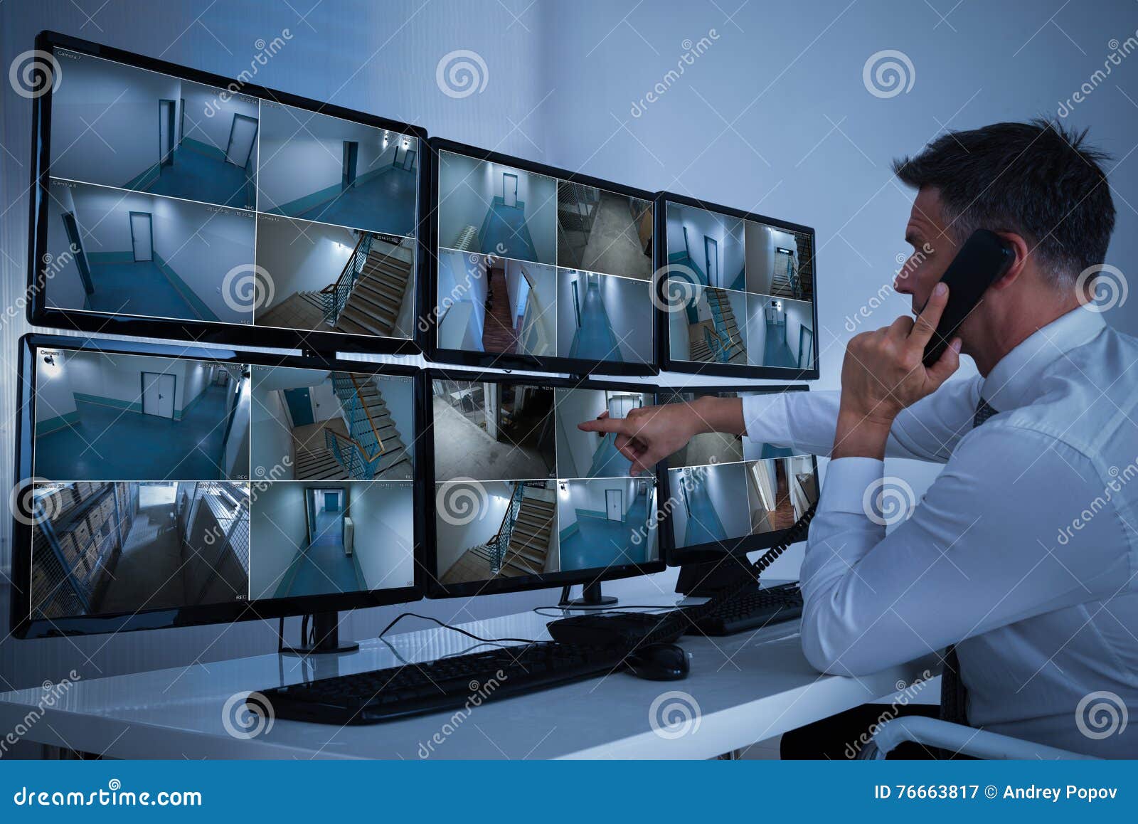 security system operator looking at cctv footage