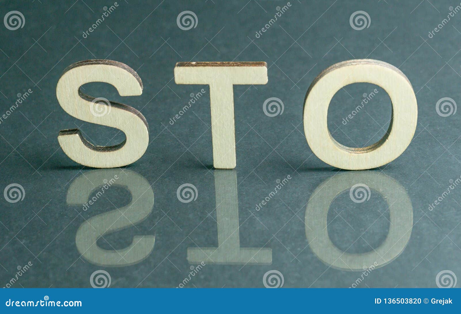 security token offering sto sign with wooden letters, ethereum concept