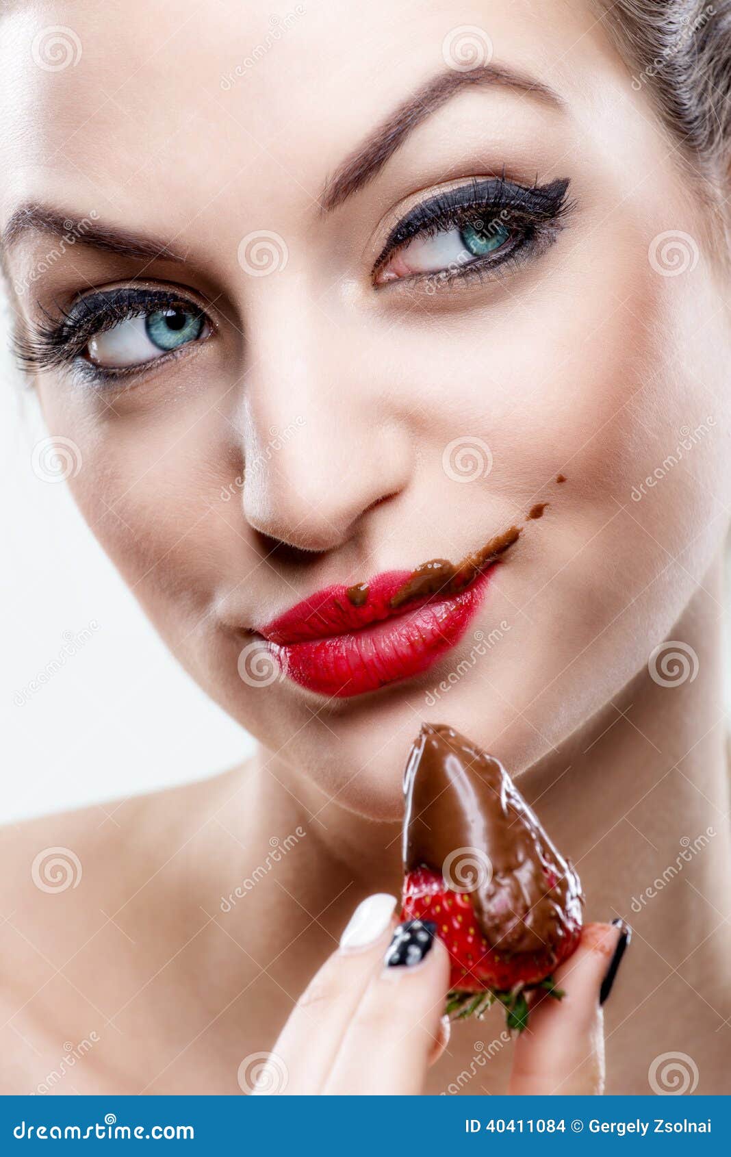 ÃÂ ÃÂ  seduction - attractive woman eating a strawberry, chocolate became the face of it