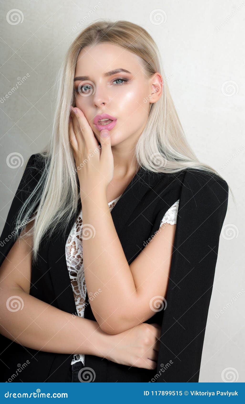 Seductive Blonde Woman With Natural Makeup Wearing Black Costume Stock