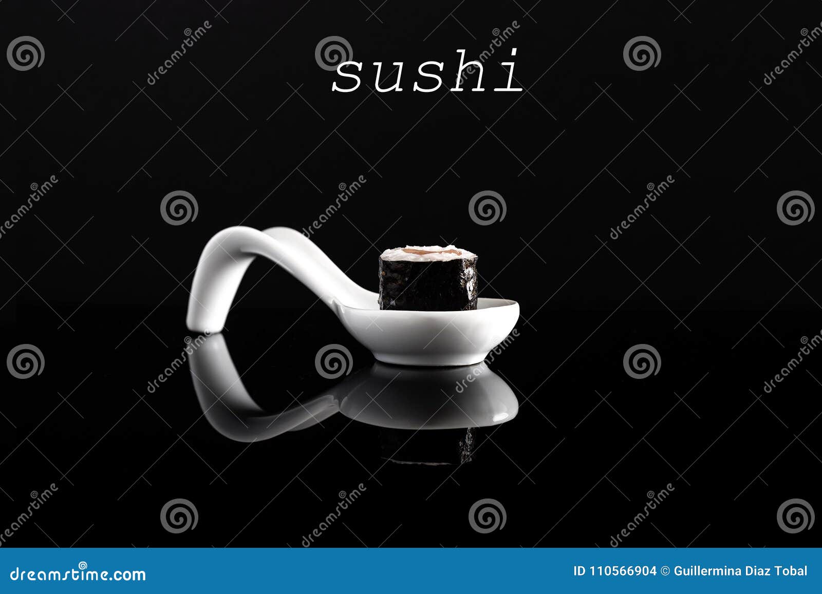 sushi 0n white spoon with black background.