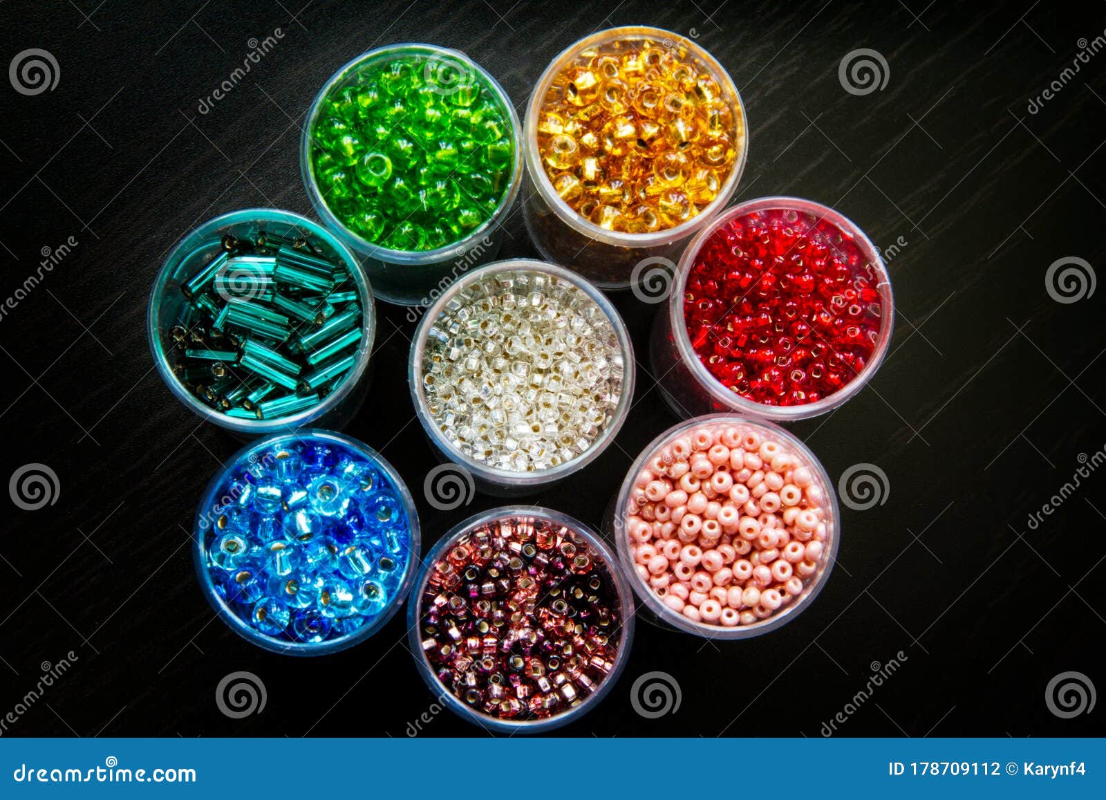 Seed Beads Of Different Sizes In Vials Arranged As A