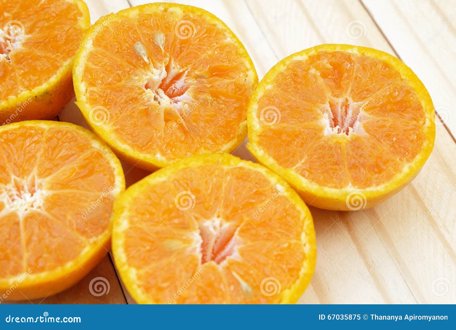 Seed (Selected Focus) of Orange Half Which is at Left Side of Fr Stock