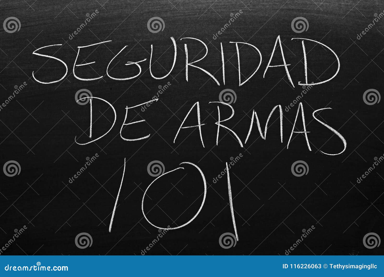 seguridad de armas 101 on a blackboard. translation: gun safety 101