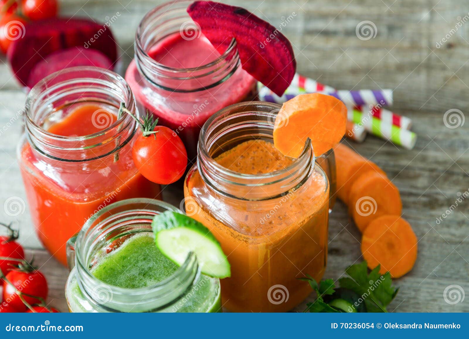 Selection of Colorful Vegetable Juices in Glass Jars Stock Photo