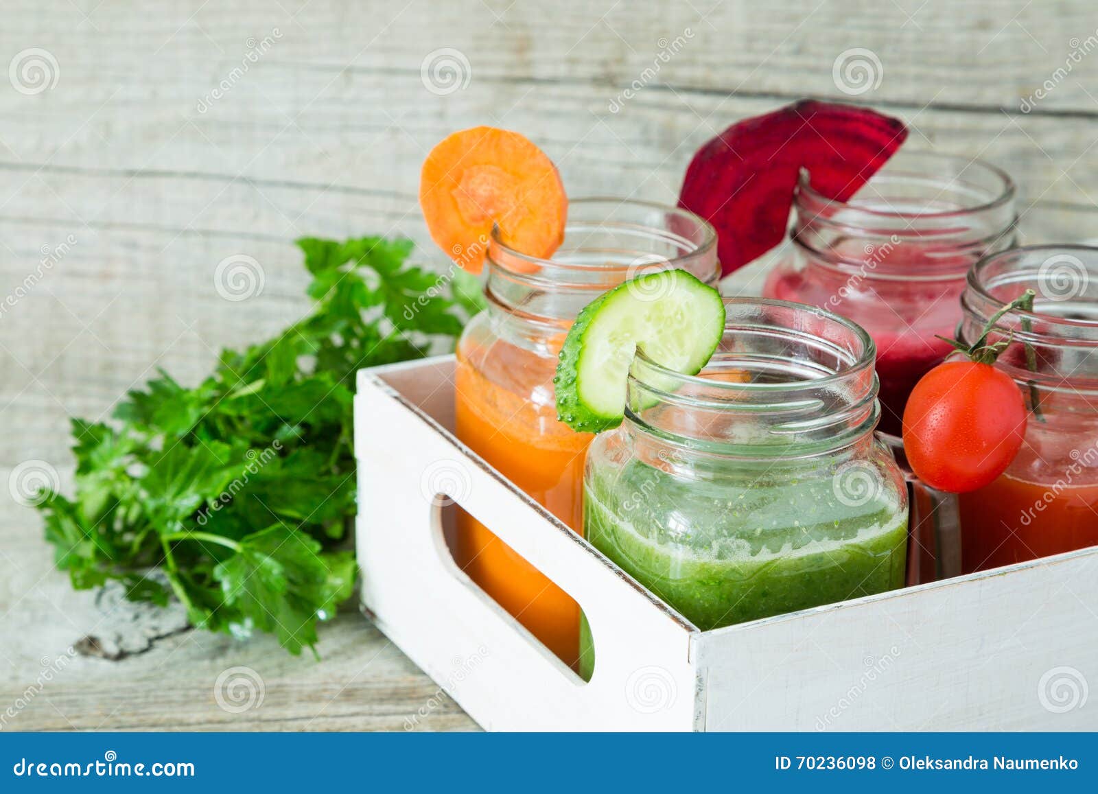 Selection of Colorful Vegetable Juices in Glass Jars Stock Photo