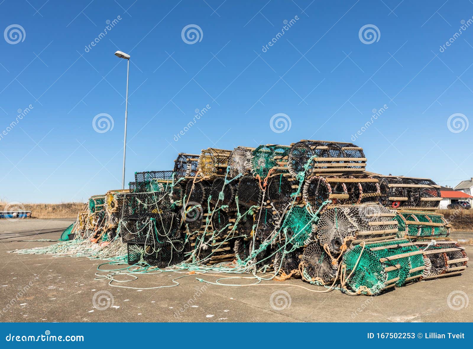 a selection of lobster pots on land, in the small fishing village lista, norway