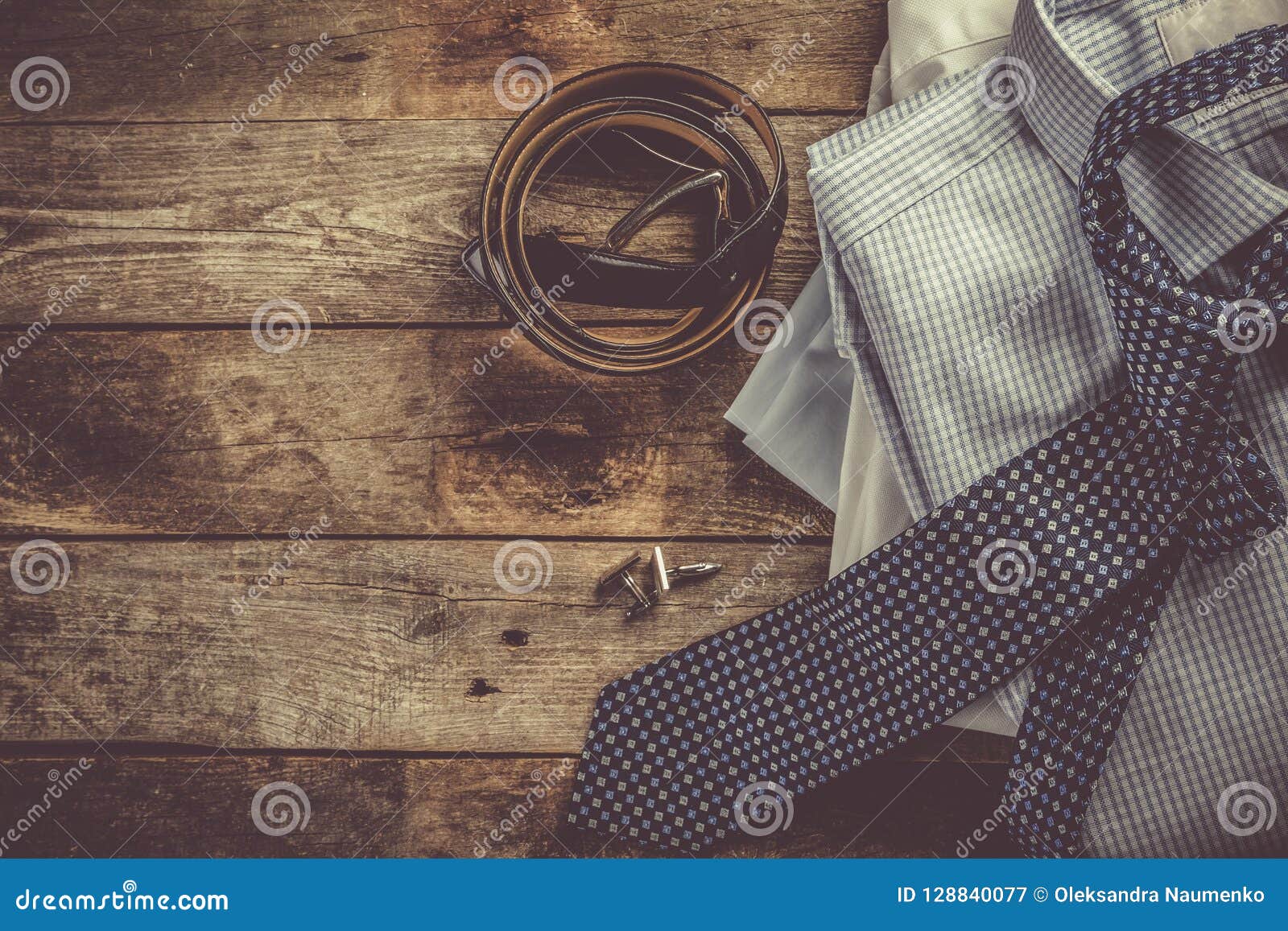 Selection of Male Clothes - Stack of Folded Shirts, Tie, Belt ...