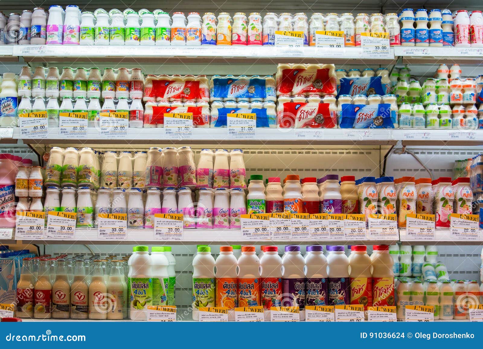 BANGKOK, THAILAND - NOVEMBER 18, 2013 : Selection of yogurts, soy milk and milk on the shelves in a supermarket Siam Paragon in Bangkok, Thailand.