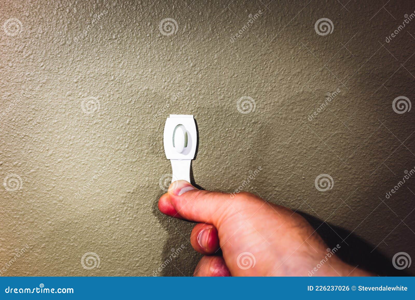 Selective Focus on Adhesive Strip Wall Hanger that Can Be Removed by  Pulling Tape Stock Photo - Image of clothes, mount: 226237026