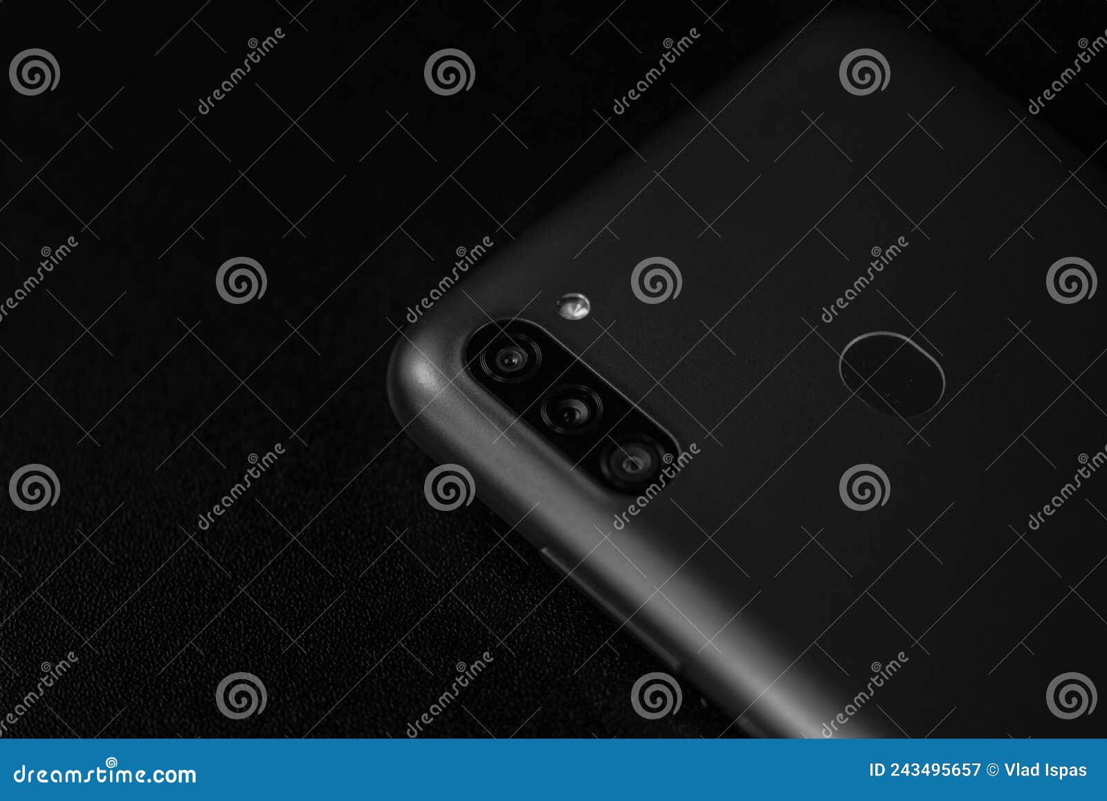 selective focus on back of new smartphone samsung galaxy m11 triple camera and fingerprint sensor. bucharest, romania, 2021