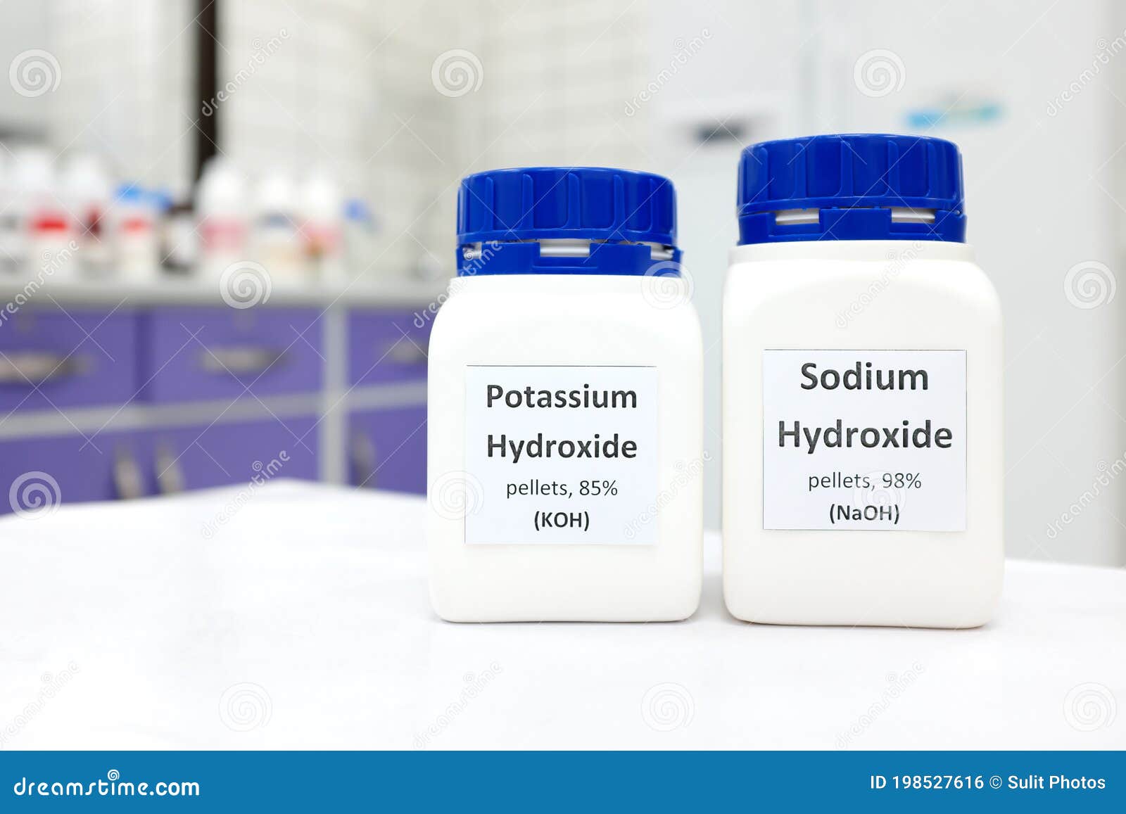 Bottle and pellets of sodium hydroxide - Stock Image - A500/0832 - Science  Photo Library