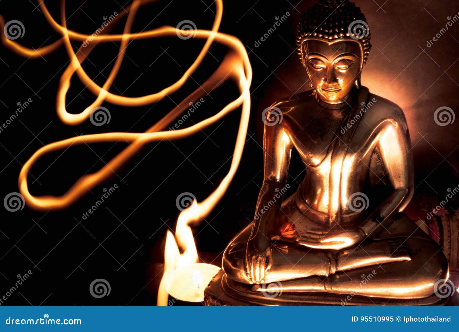 Selective Focus of Buddha Statue with Blurred Burning Candle Light ...