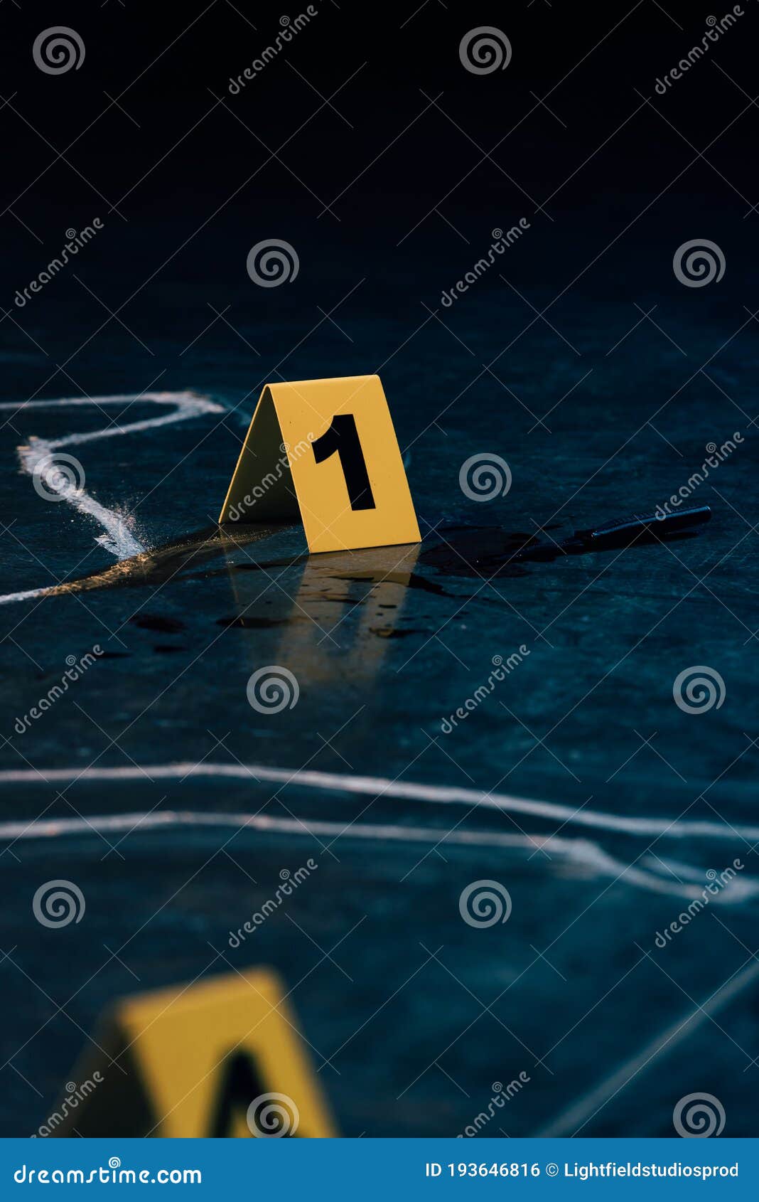 Selective Focus Of Chalk Outline And Evidence Markers Stock Photo