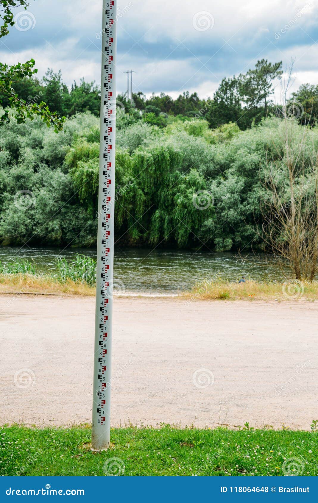 selective focus of close up water level depth marker measurement tape on edge of river for monitoring and preventing
