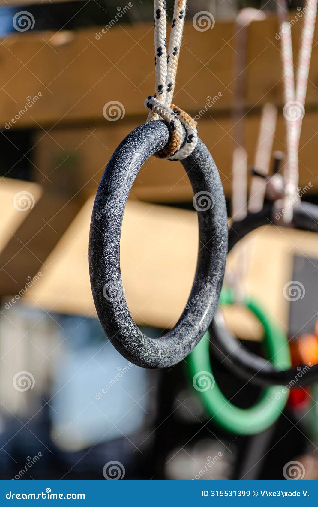 selective focus. detail of the rings of one of the obstacles of an obstacle race course, ocr
