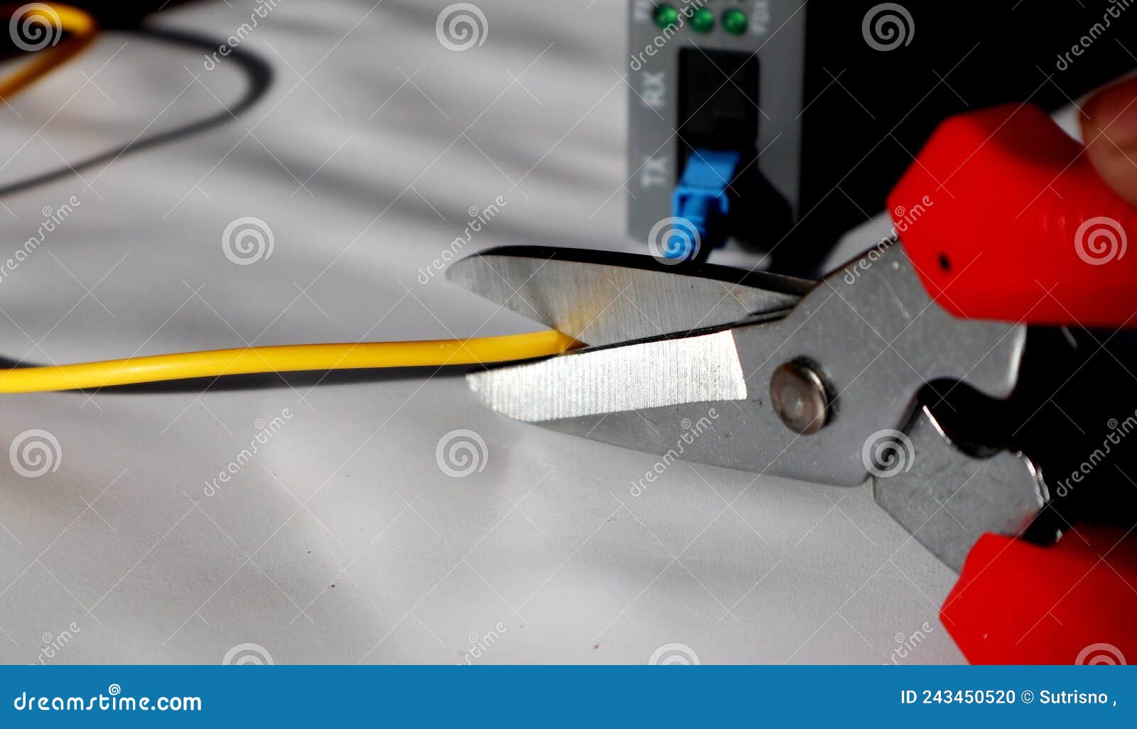 Selective Focus Scissors Cut Fiber Optic Network Cables. Cut the
