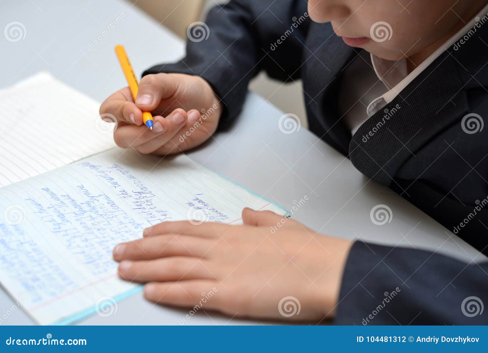 selective focus of little boy learning how to write his name, kid study at home, children do homework at home, concept for toddler