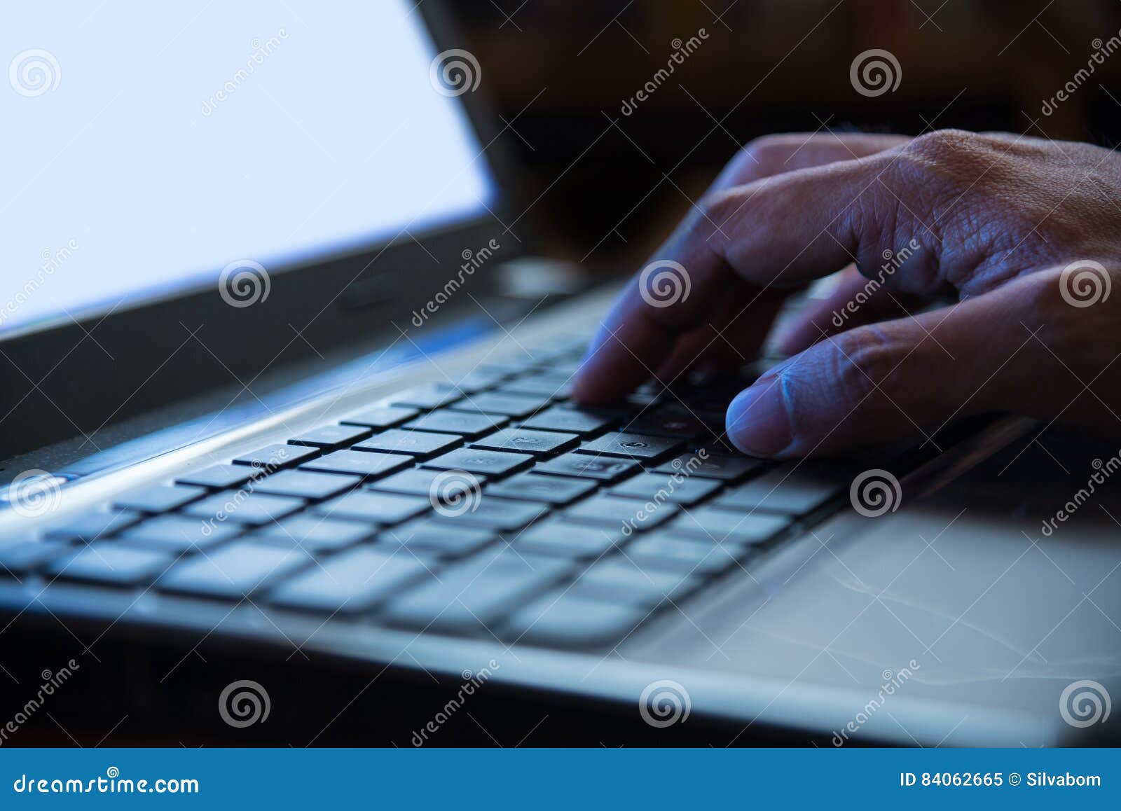 selective focus on man hand typing laptop/pc/computer keyboard i