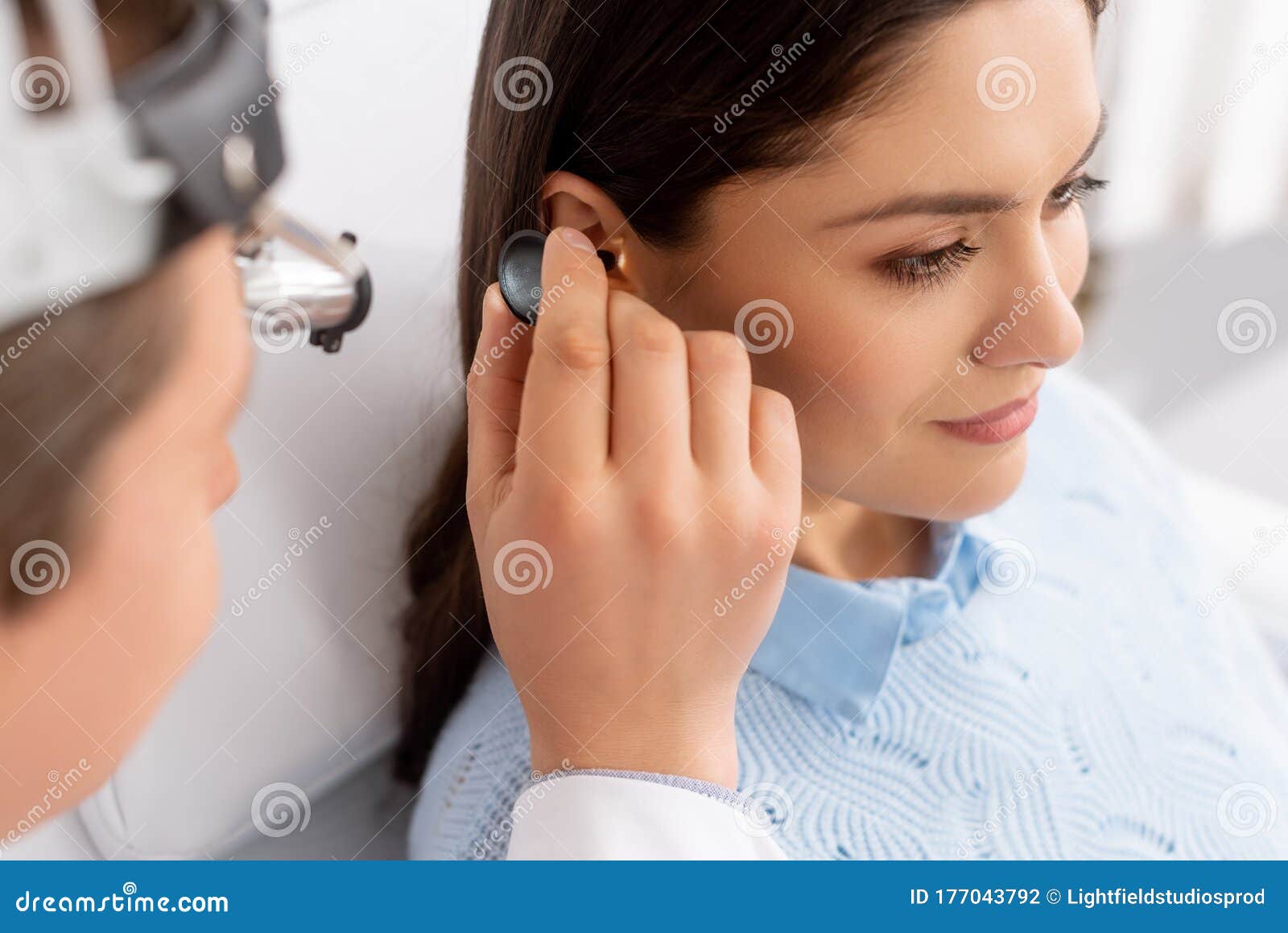 focus of otolaryngologist examining ear of