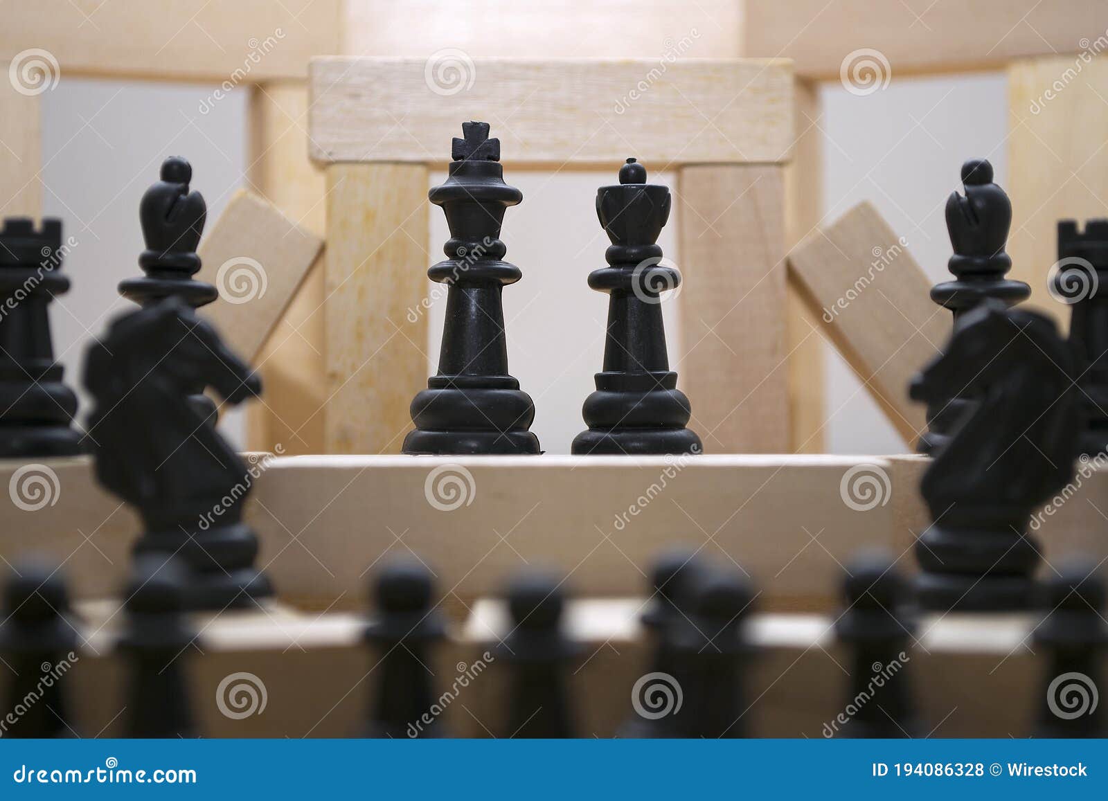 Selective Focus of the Queen and King Pieces of Chess on a Wooden