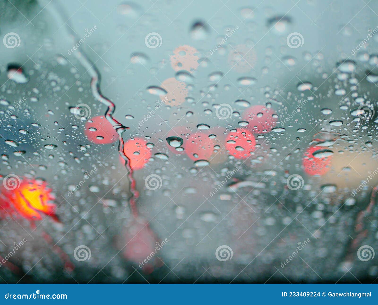 Selective Focus of Rain on the Windshield of a Car on a Rainy Day Stock