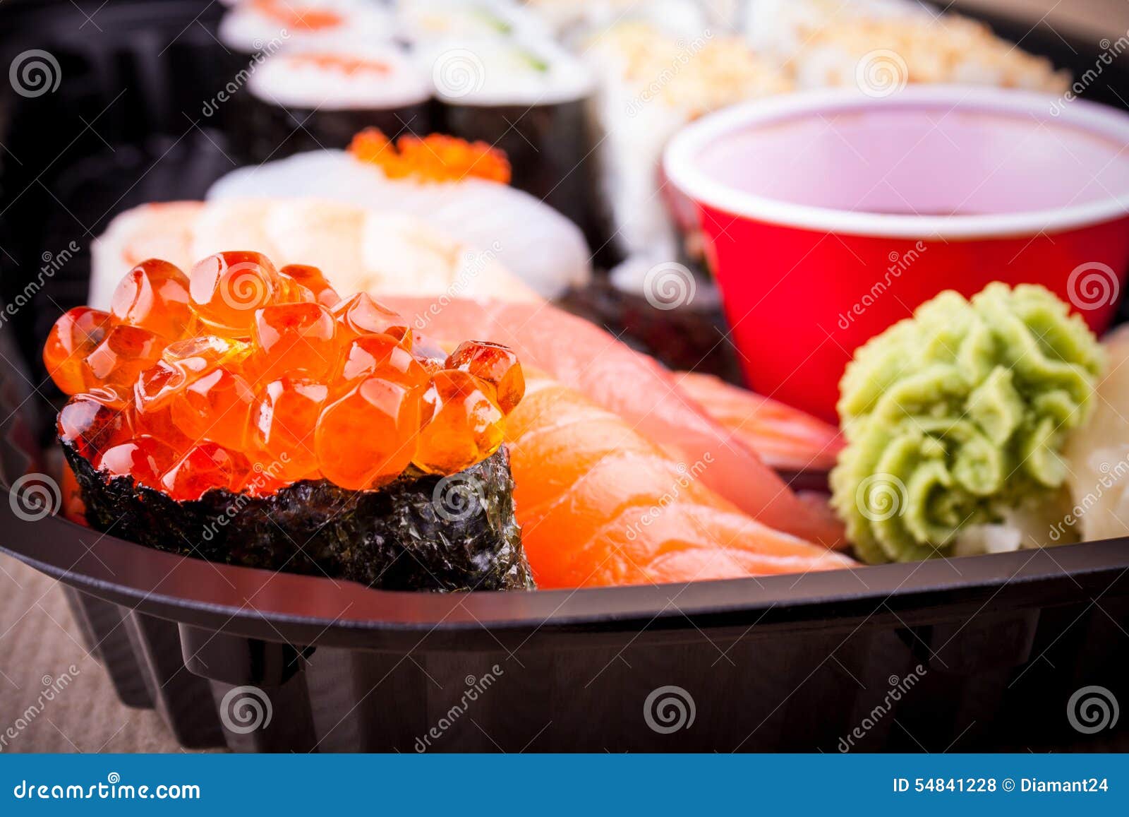 Selective focus of salmon caviar ikura sushi closeup