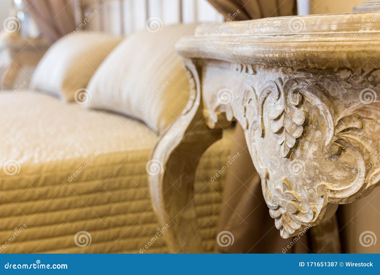 Selective Focus Shot of an Antique Table beside the Bed in the Bedroom