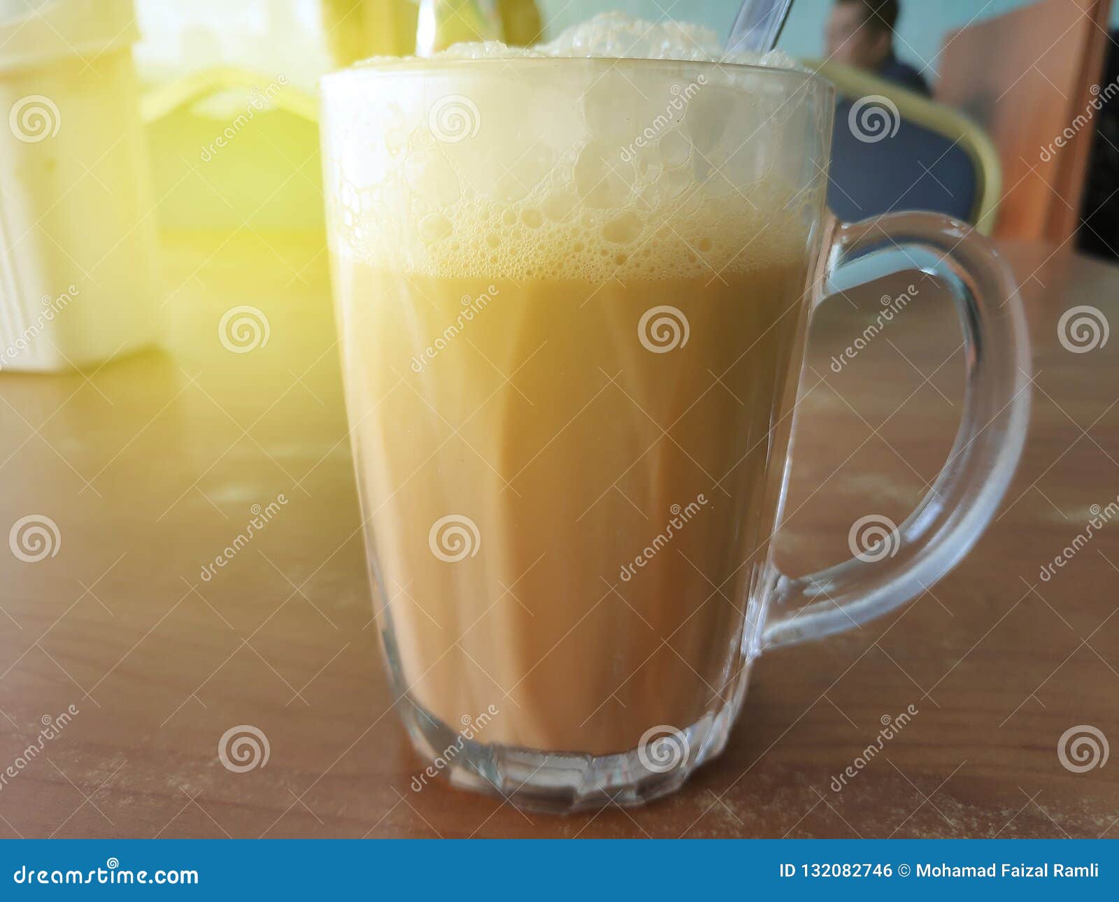 selective focus of tea with milk in a mug or popularly known as teh tarik in malay language.