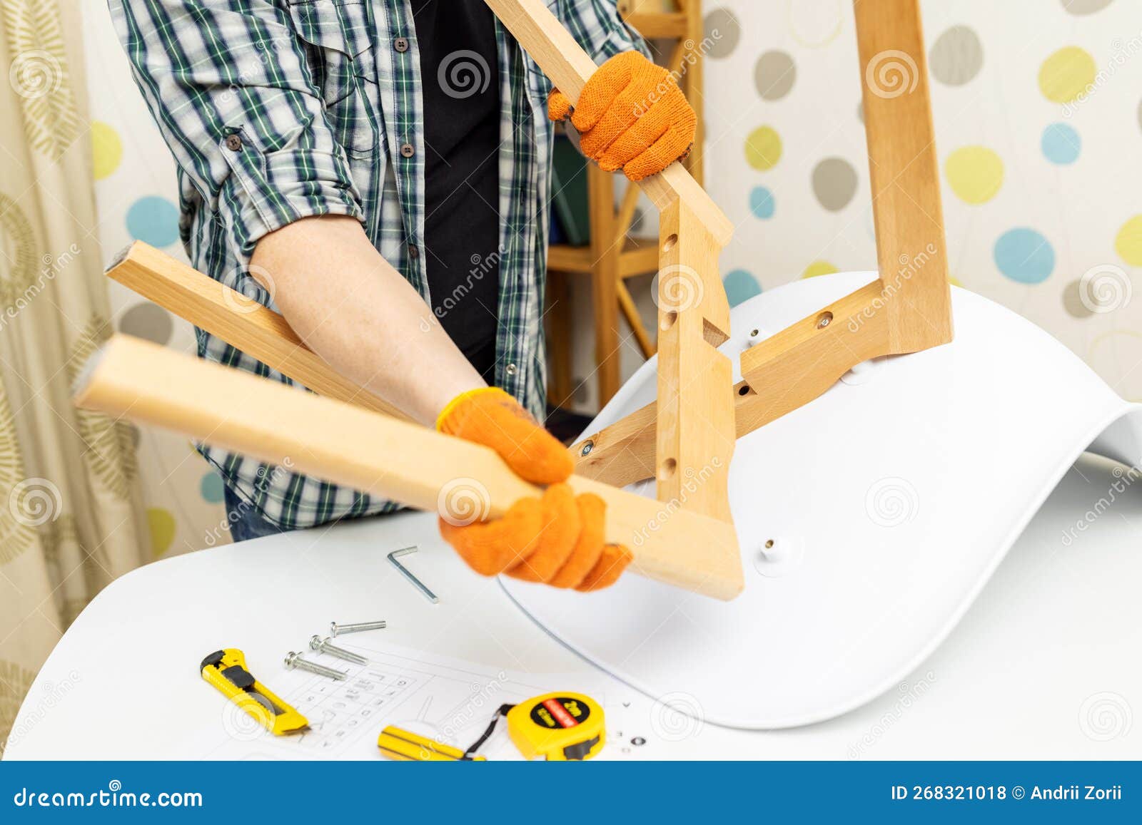 Selfassembly Furniture Concept. the Young Man Himself Assembling