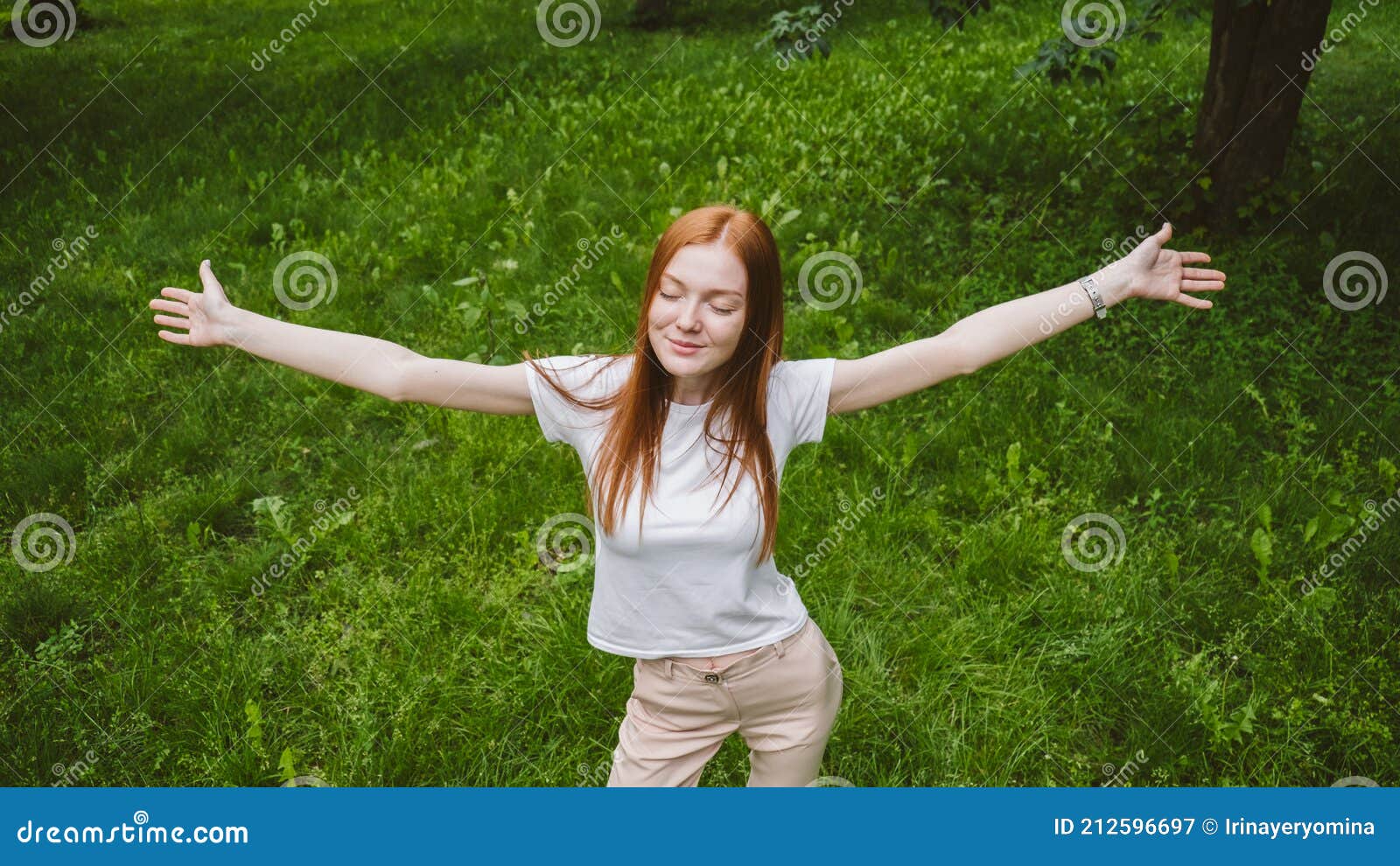 self care, mental wellbeing, mental health, mindfulness. young red-haired woman enjoying life in nature among flowers