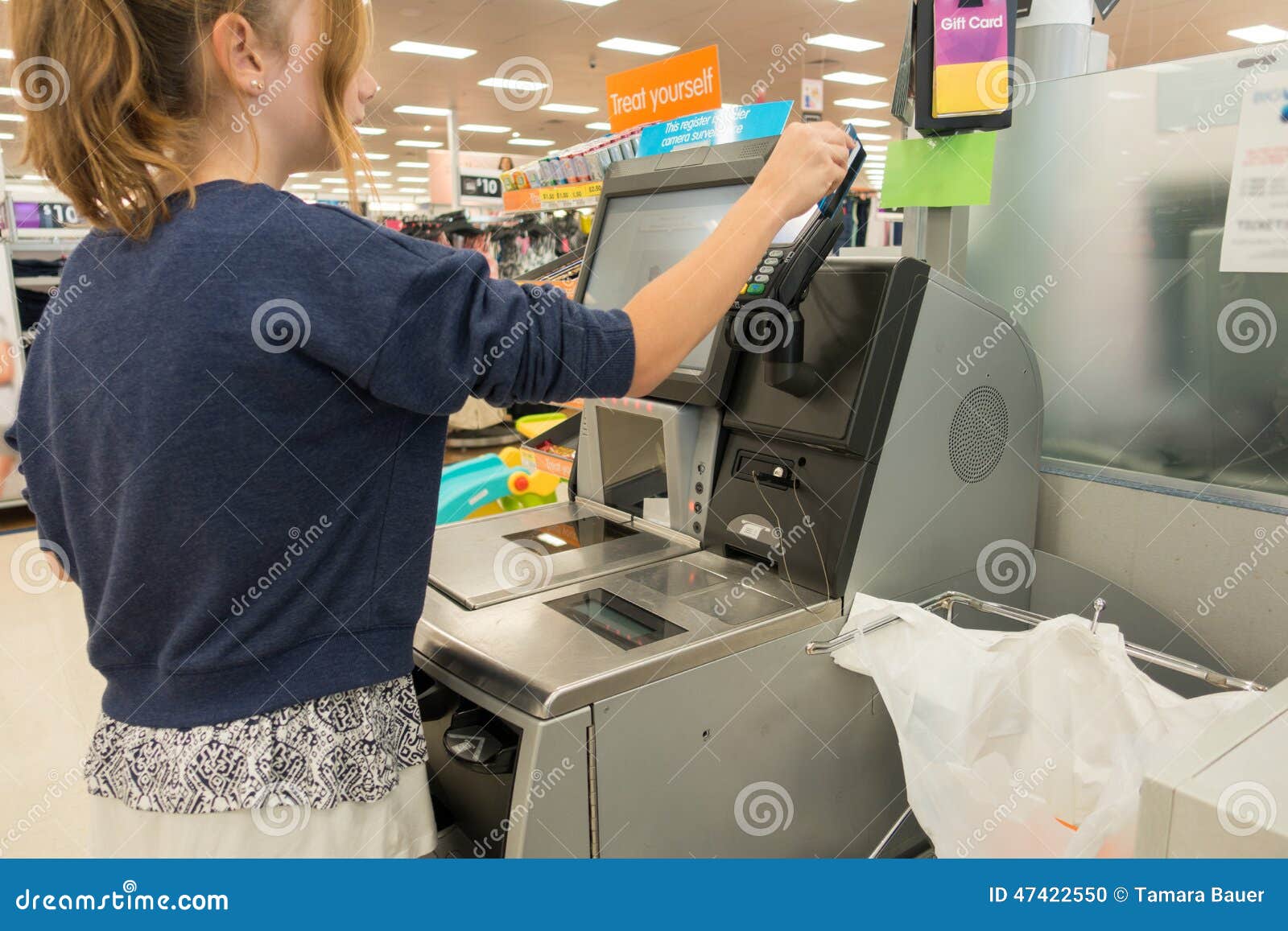 shopper, self checkout at department store