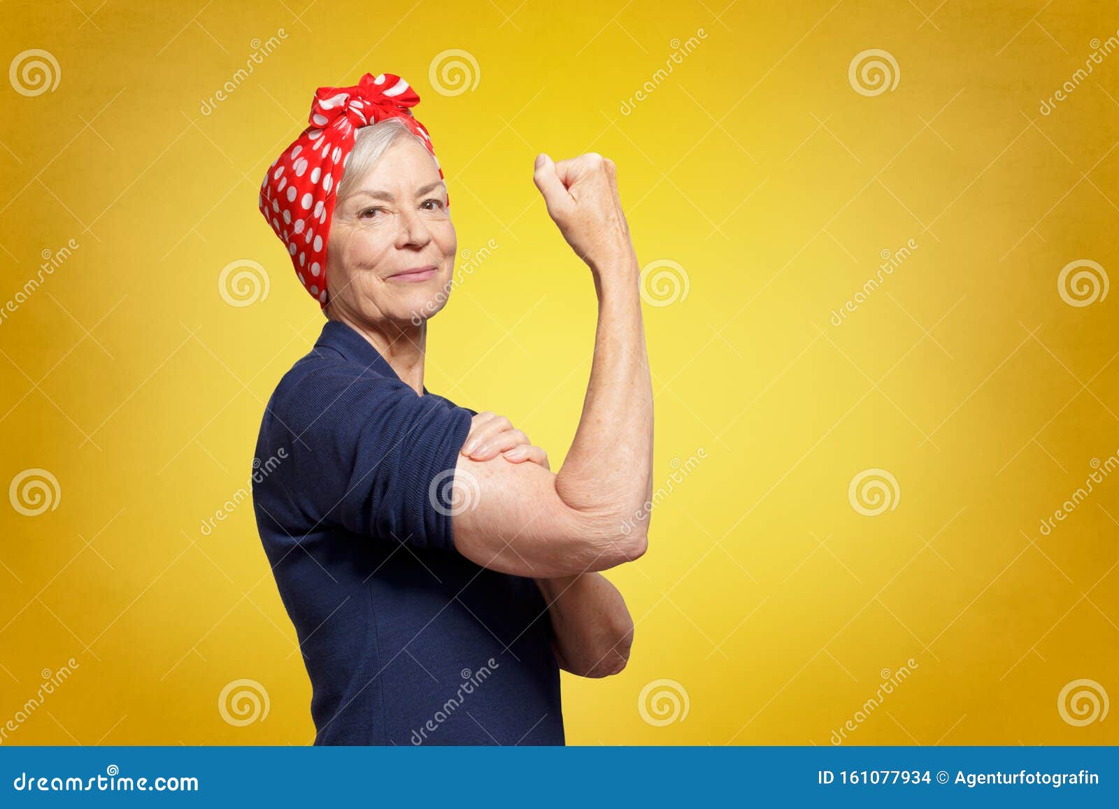 self-confident senior woman rosie riveter