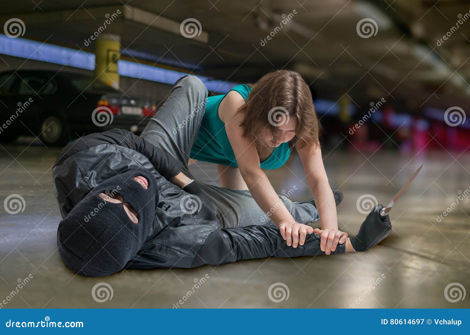 self defense concept. young woman is fighting with mugger or thief