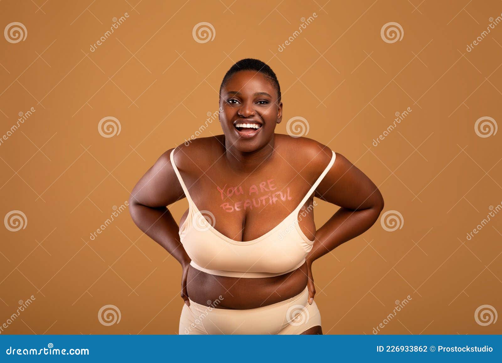 Self Acceptance, Love And Care. Portrait of confident fat black woman with  perfect skin and body posing isolated in studio background, free copy  space. Gorgeous Lady with chubby body enjoy herself Stock