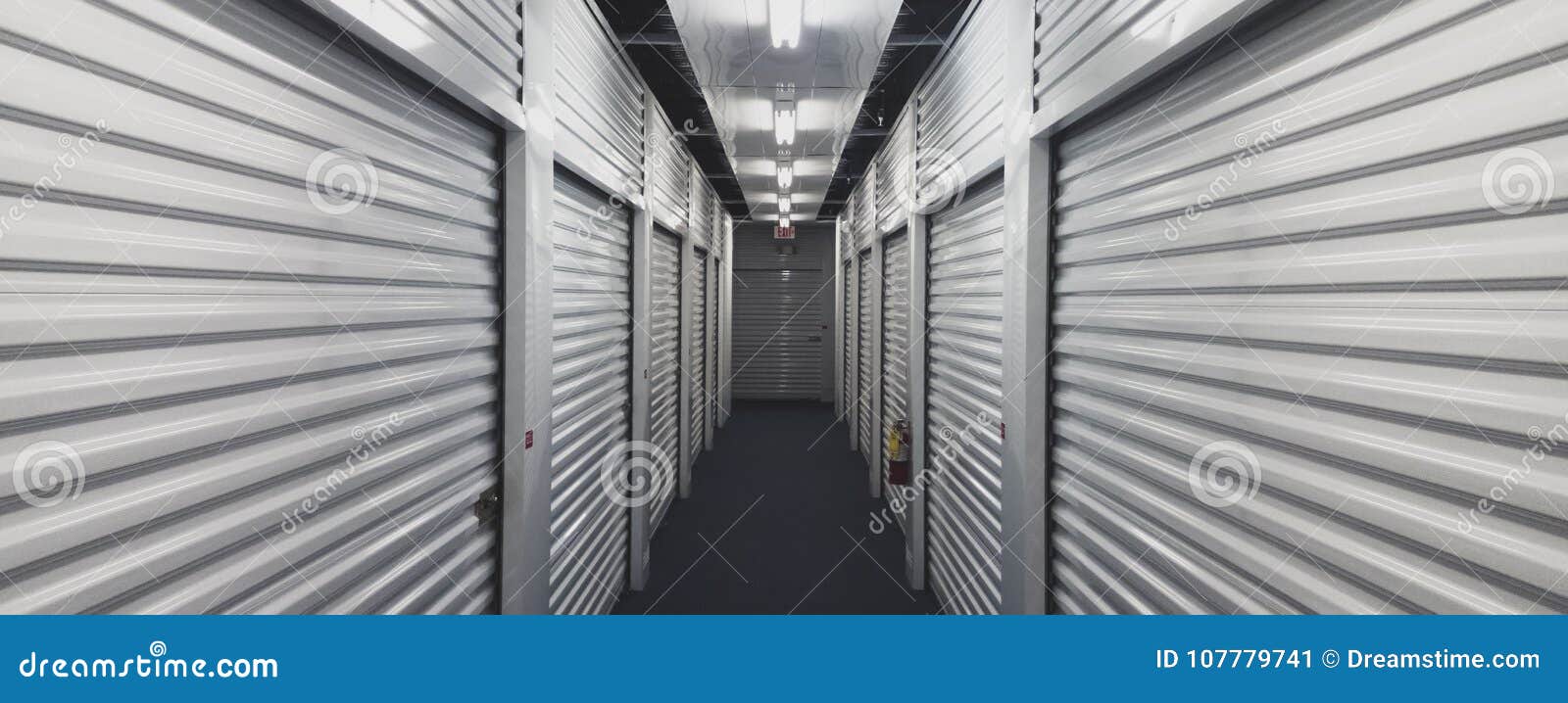 Self Storage Unit Doors on Each Side of an Indoor Hallway. Stock Image
