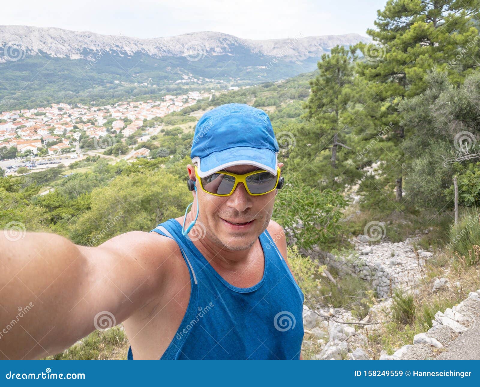 selfie of cool trailrunning man in croatia on the island krk in baska in summer