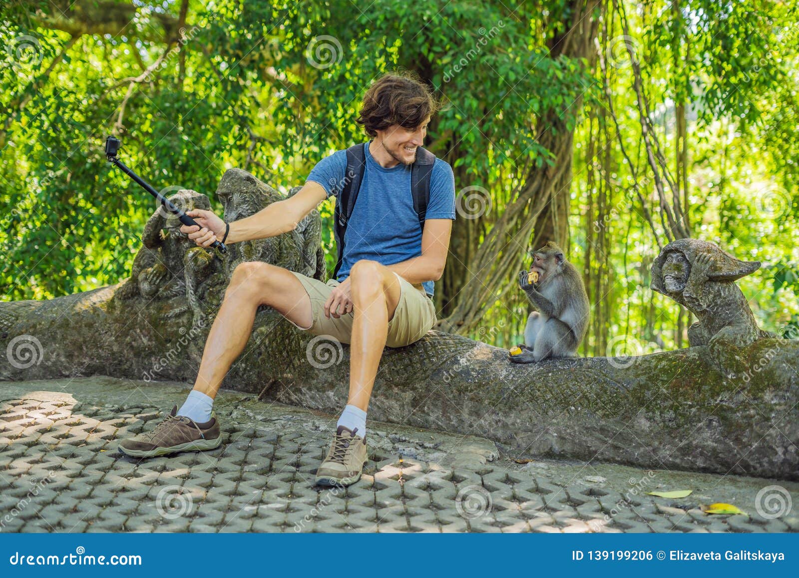Selfie with Monkeys. Young Man Uses a Selfie Stick To Take a Photo or Video  Blog with Cute Funny Monkey Stock Photo - Image of mobile, blog: 139199206