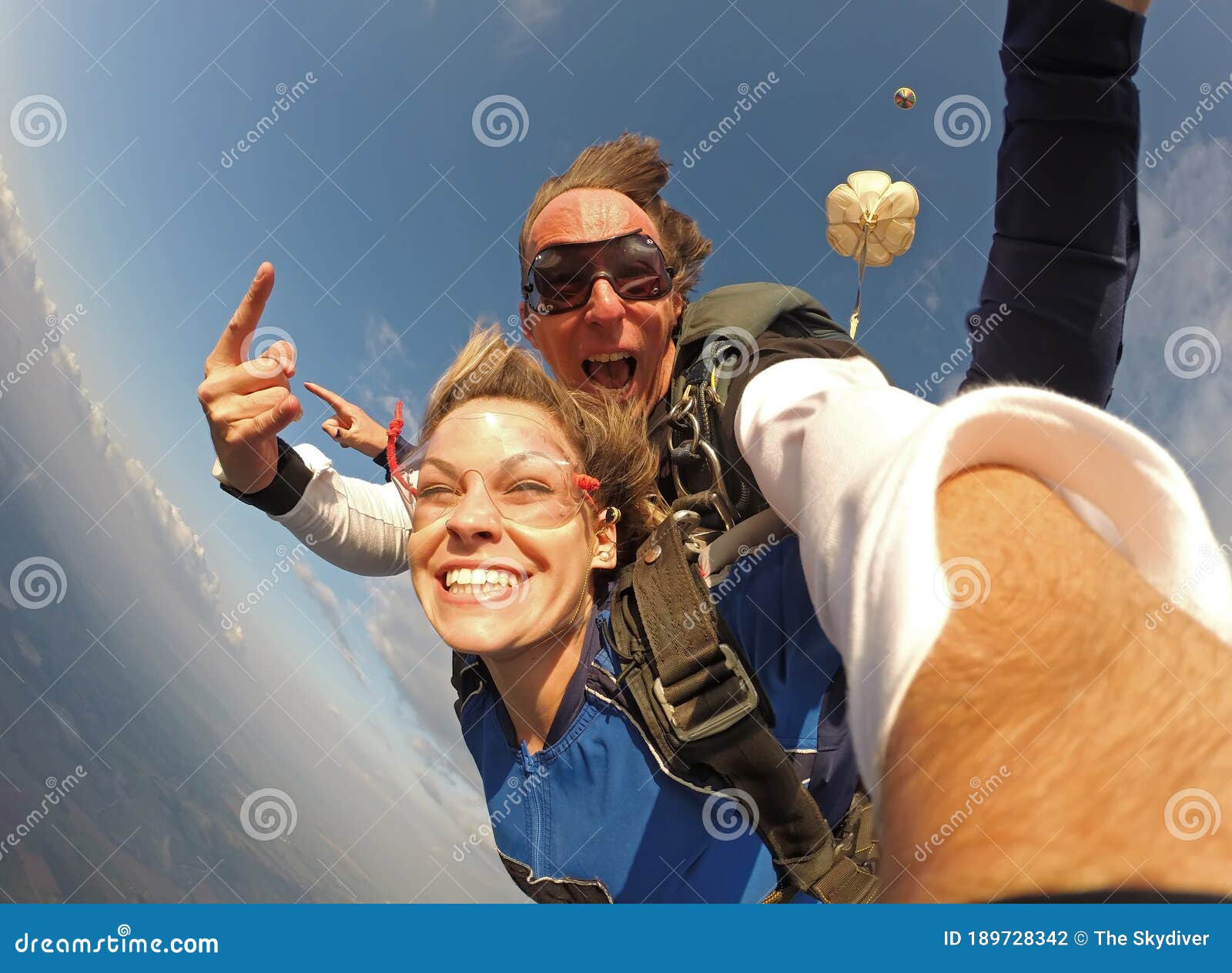 selfie tandem skydiving with pretty woman