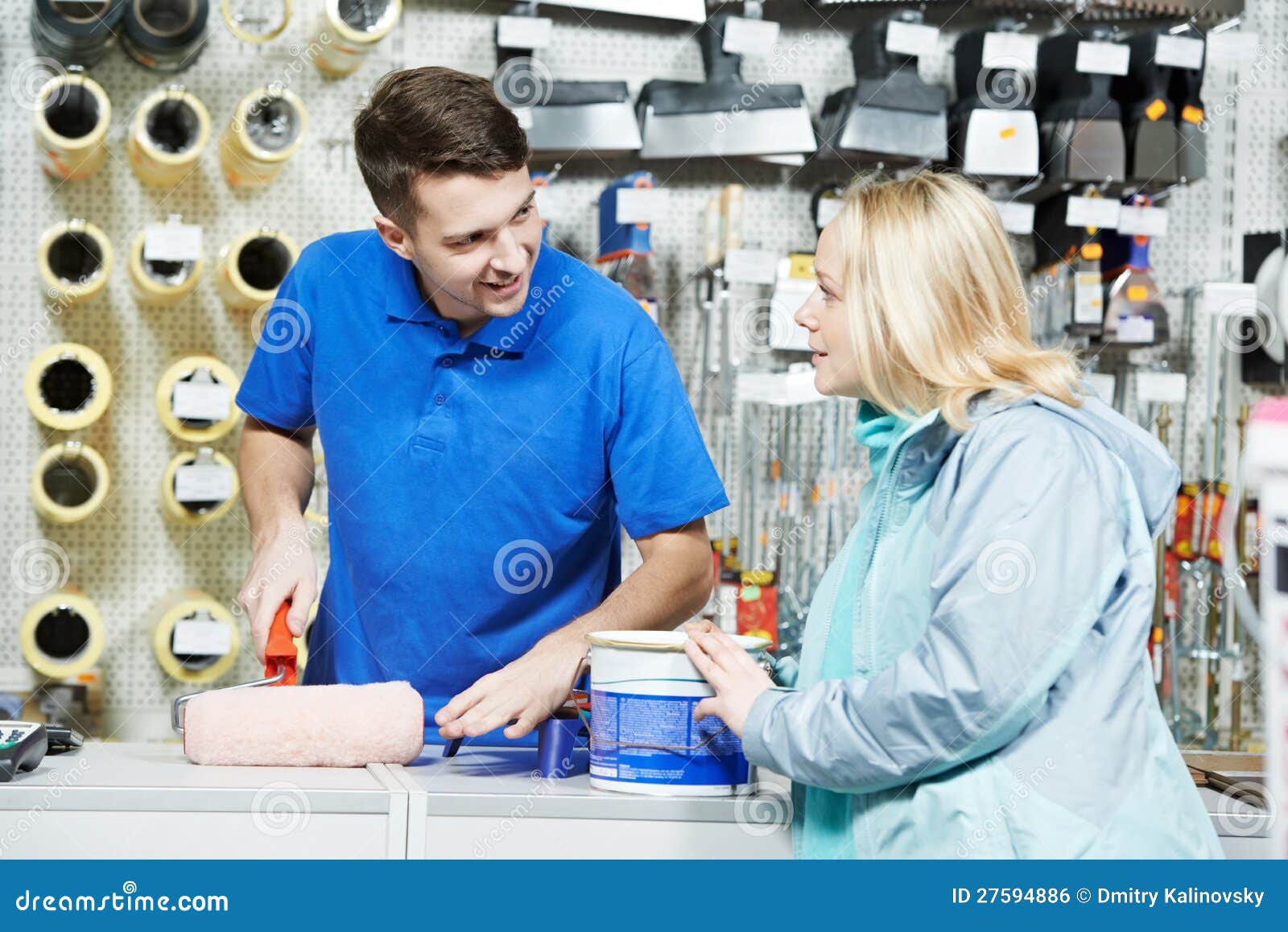 seller demonstrating paint roller to buyer