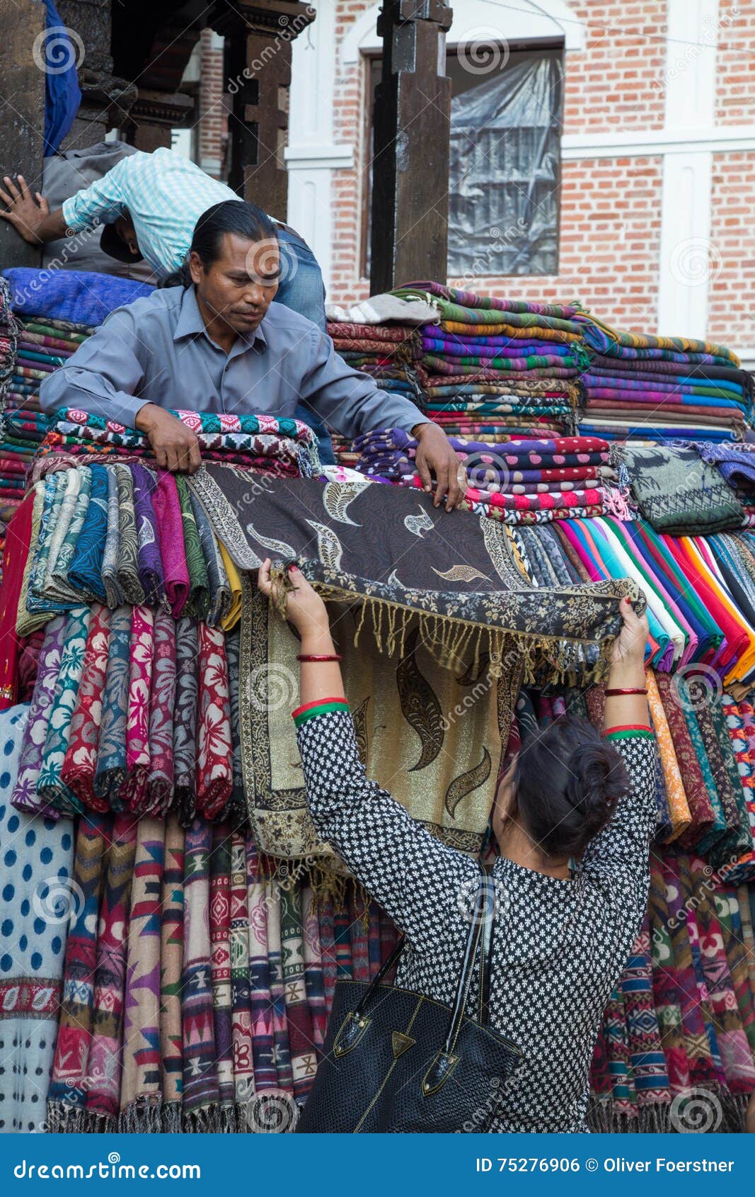 https://thumbs.dreamstime.com/z/selling-scarfs-market-kathmandu-nepal-october-seller-showing-to-customer-75276906.jpg