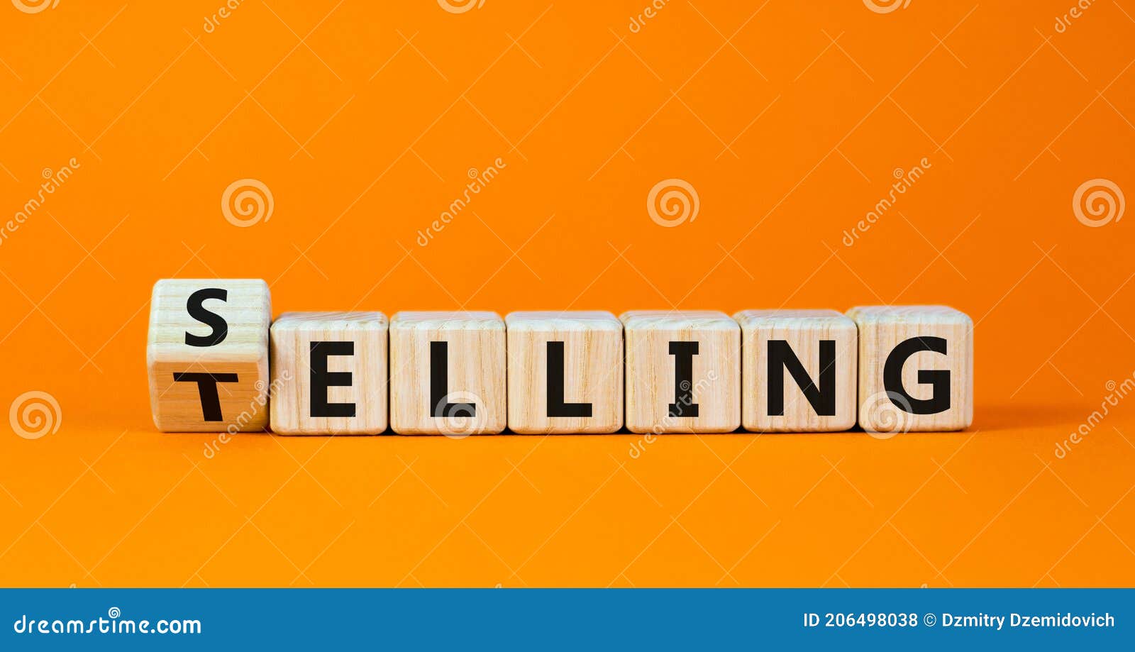 selling or telling . turned wooden cubes and changed the word `telling` to `selling`. beautiful orange background, copy
