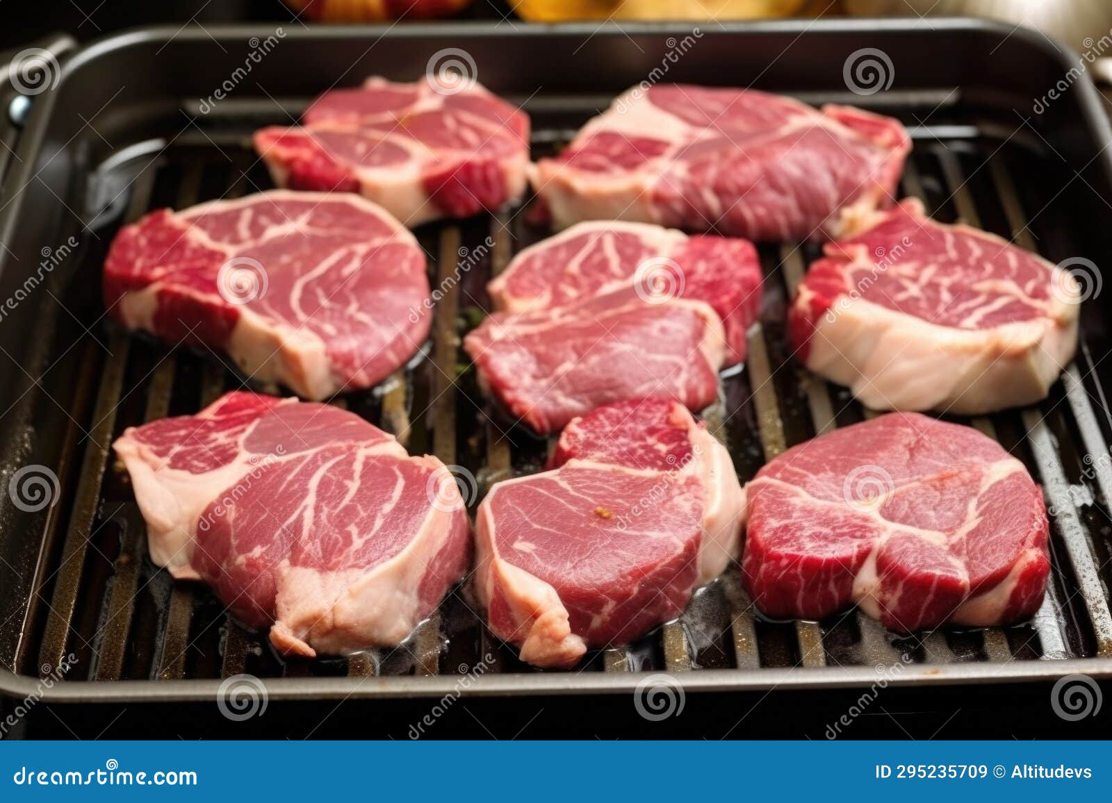 Semicooked Lamb Chops Featuring Grill Marks on a Stovetop Grill Pan