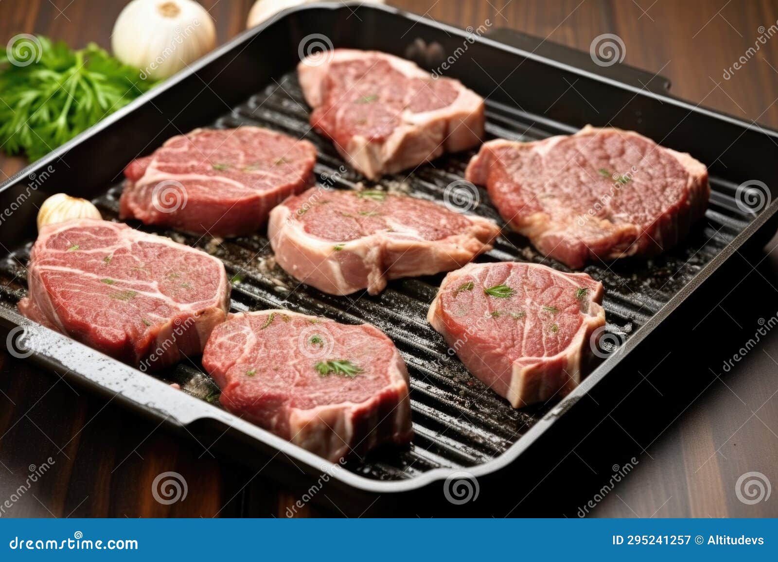 Semicooked Lamb Chops Featuring Grill Marks on a Stovetop Grill Pan