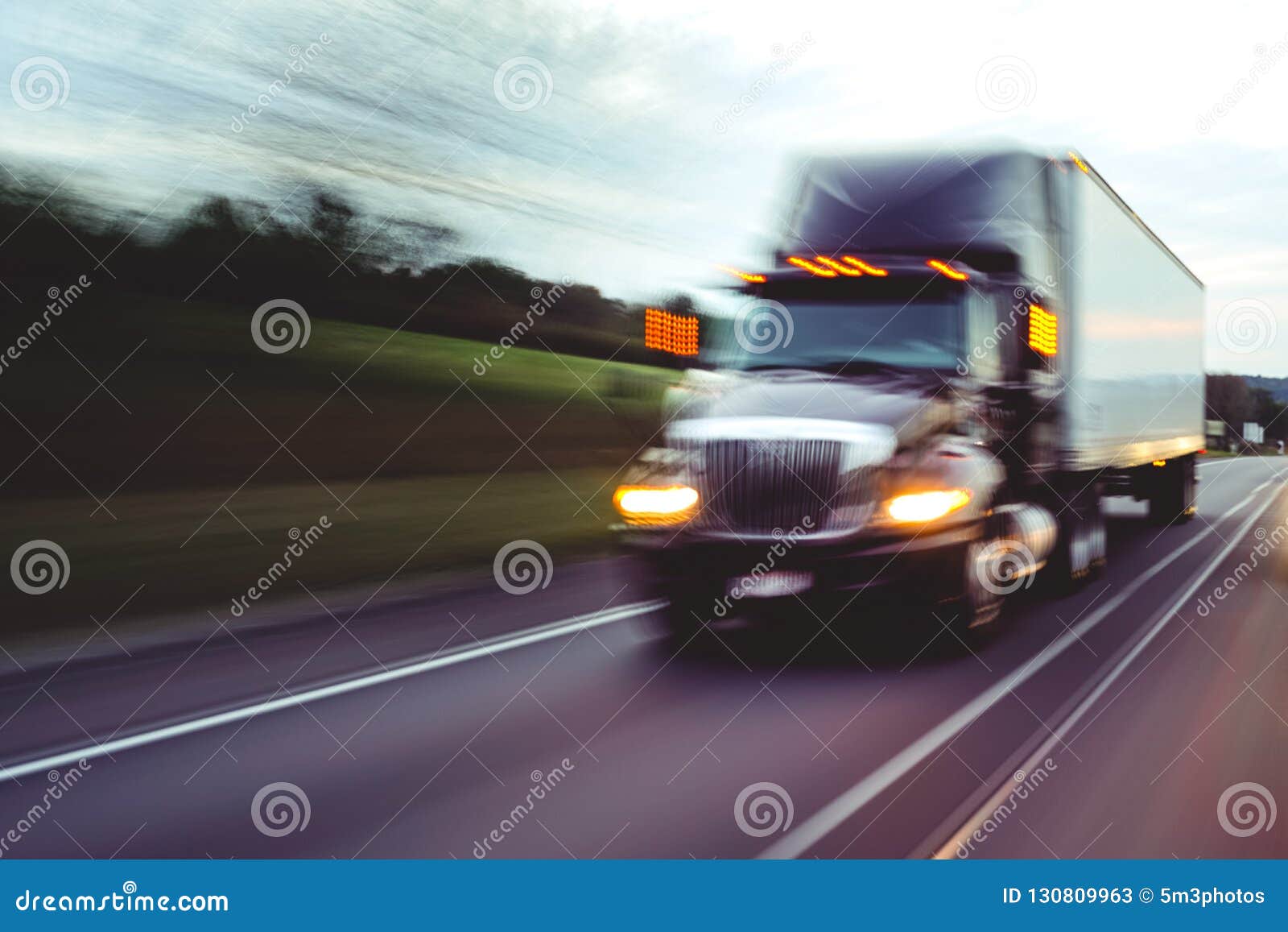 semi truck on highway concept with motion blur