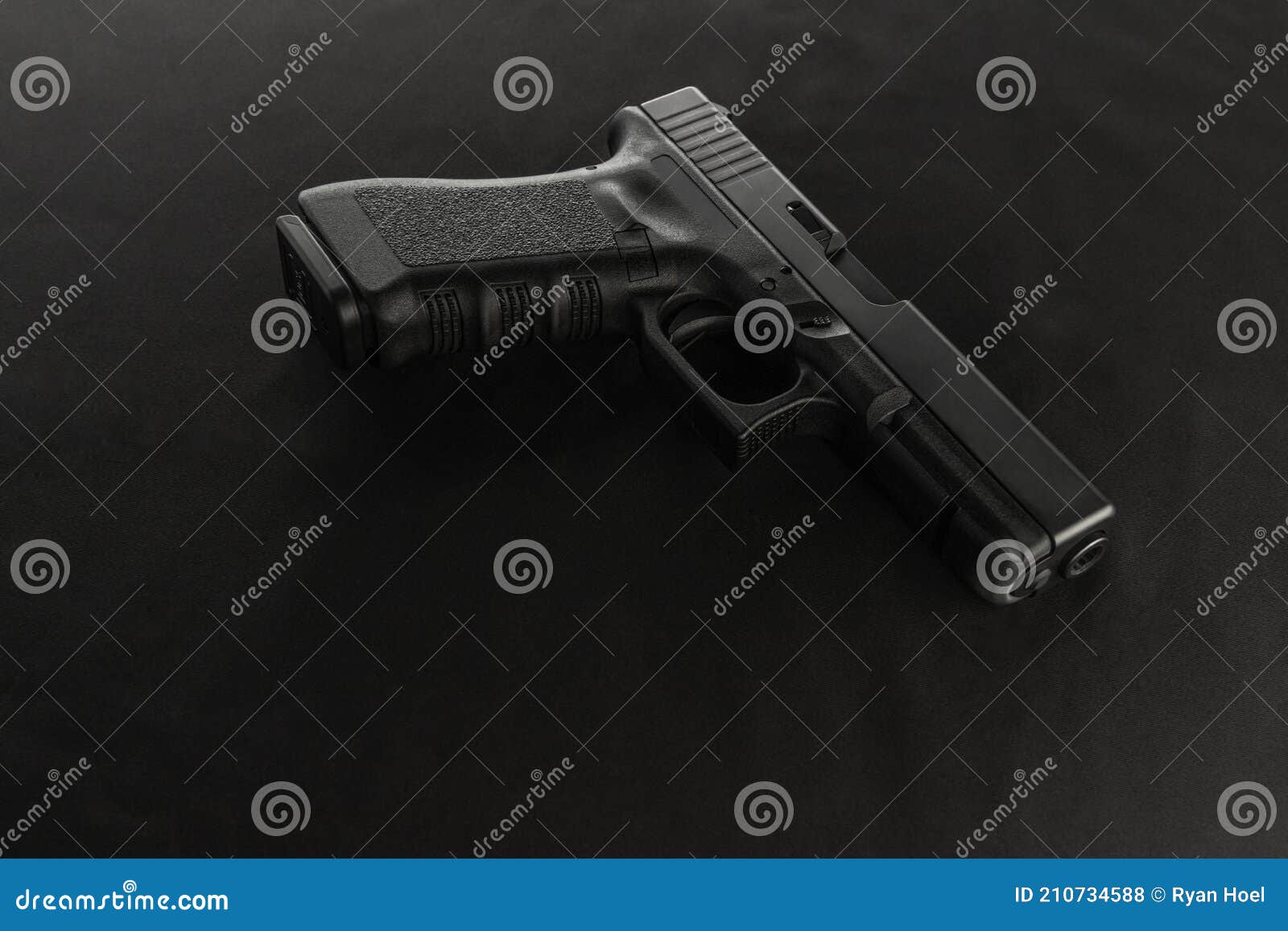 a semiautomatic pistol on a black background