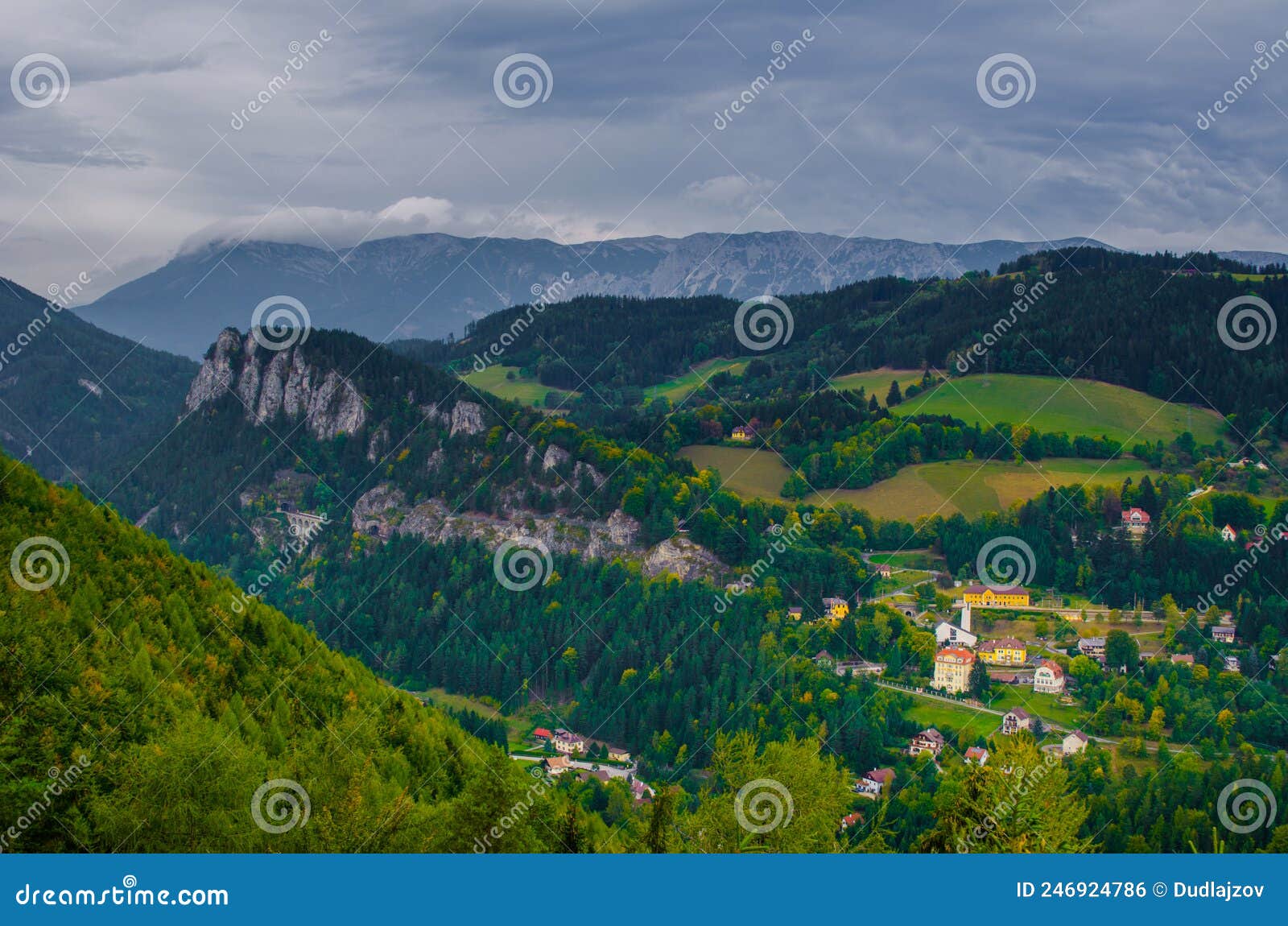 semmering railway with surrounding mountain scenery, krauselklause viaduct in front of polleroswand. in the background